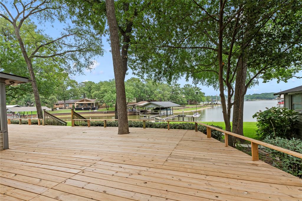 111 Deer Island Road Mabank, TX 75156 - Photo 4 of 26 Step out onto the back porch from your primary bedroom over looking the peaceful cove.