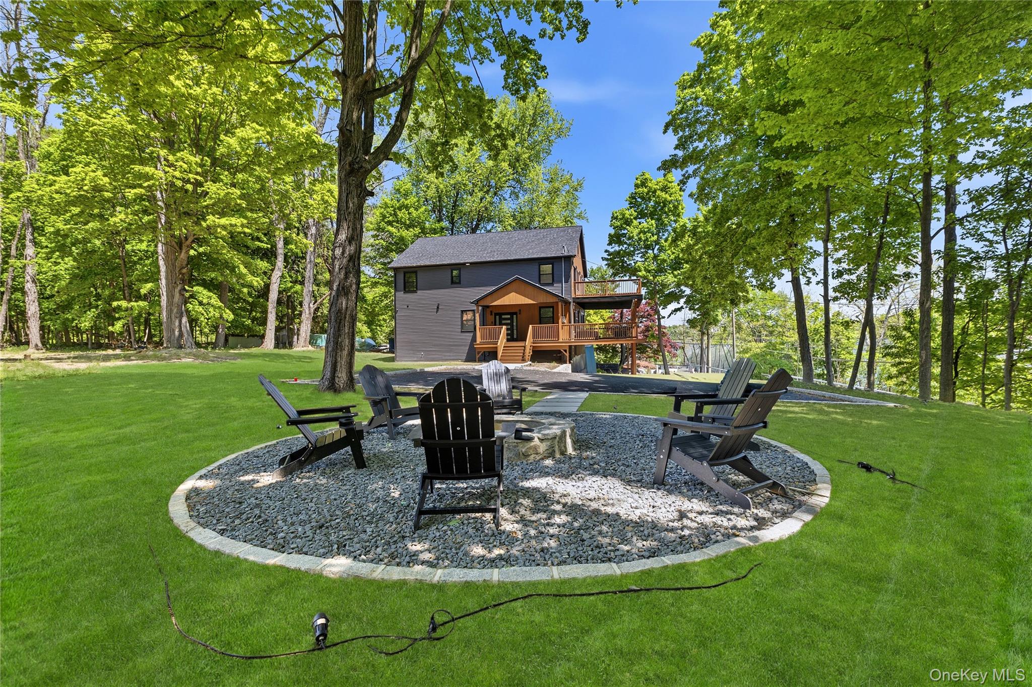 548 Lakes Road Monroe, NY 10950 - Photo 8 of 50 a view of a house with a backyard porch and sitting area