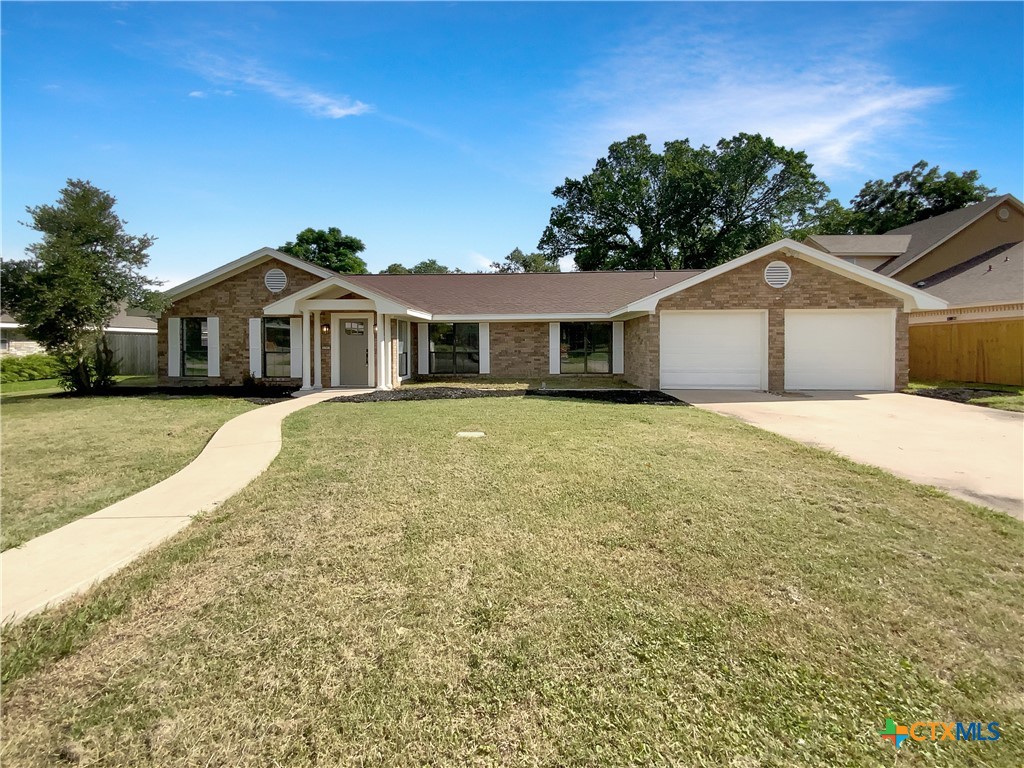 3202 Magnolia Boulevard Temple, TX 76502 - Photo 1 of 20 a front view of a house with a yard and trees