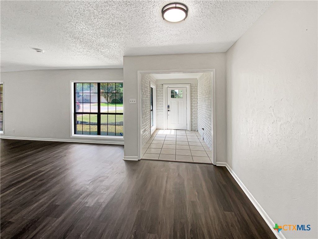 3202 Magnolia Boulevard Temple, TX 76502 - Photo 18 of 20 wooden floor in an empty room with a window