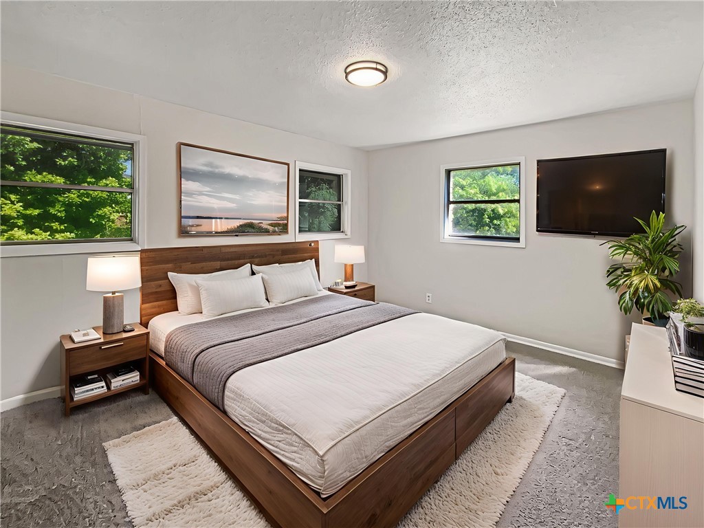 3202 Magnolia Boulevard Temple, TX 76502 - Photo 4 of 20 a bedroom with bed and a flat screen tv
