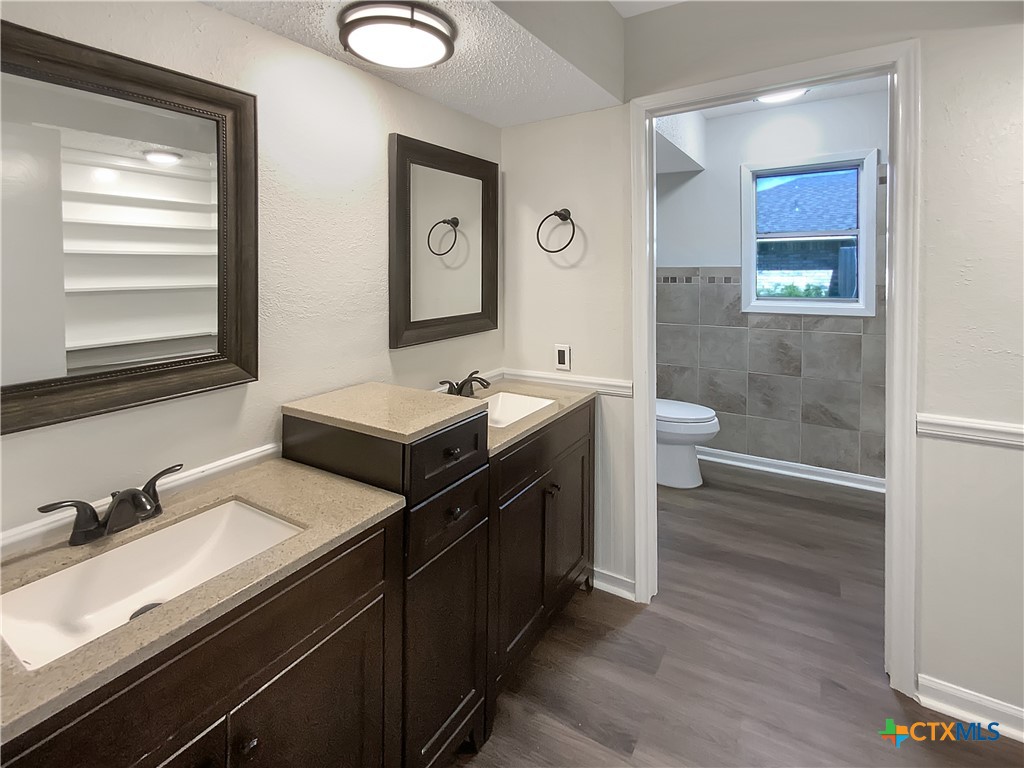 3202 Magnolia Boulevard Temple, TX 76502 - Photo 7 of 20 a bathroom with a sink and a mirror