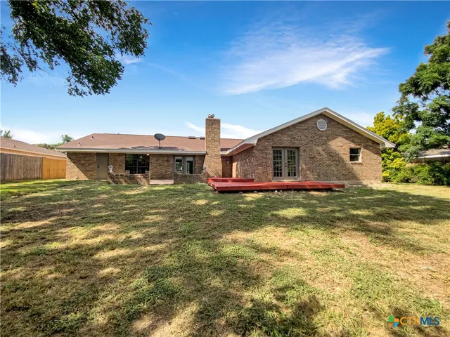 a front view of house with garden