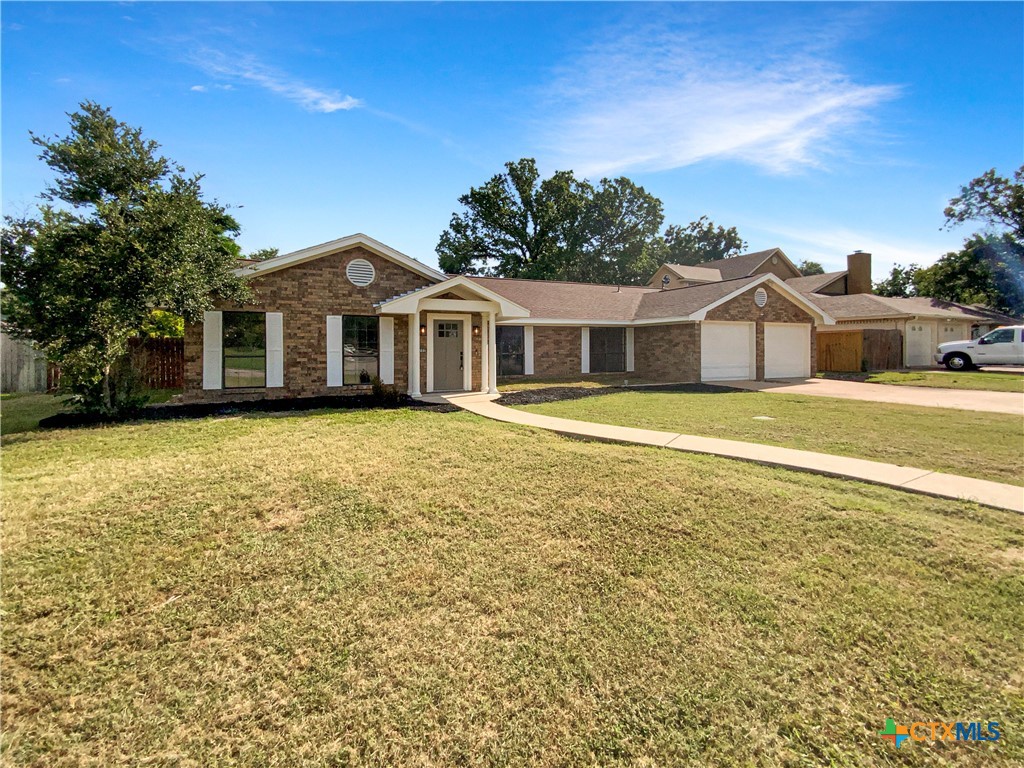 3202 Magnolia Boulevard Temple, TX 76502 - Photo 9 of 20 a front view of a house with a yard