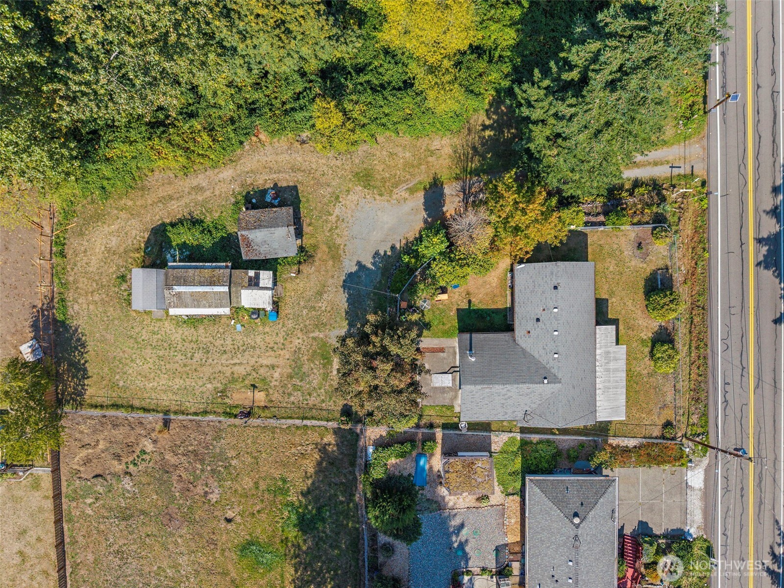 an aerial view of residential houses with outdoor space