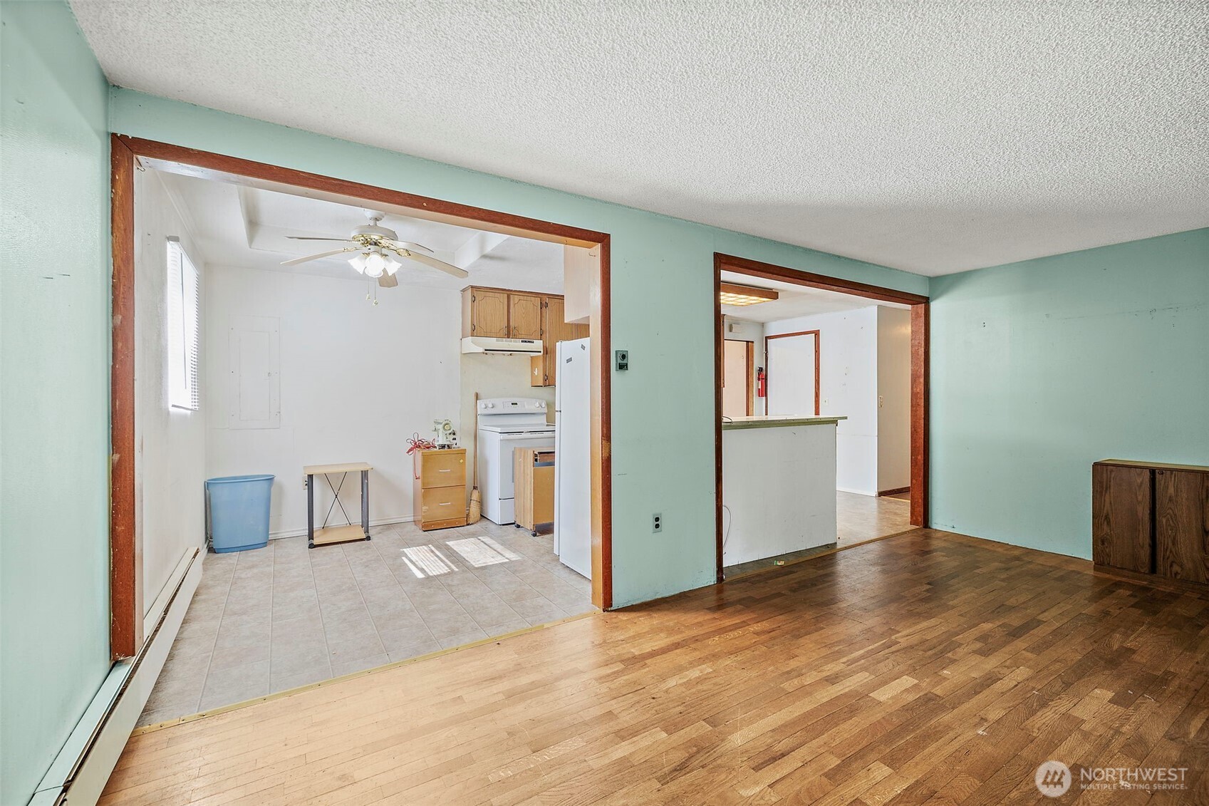 13435 Patriot Way Renton, WA 98059 - Photo 14 of 36 a view of a room with wooden floor and cabinet