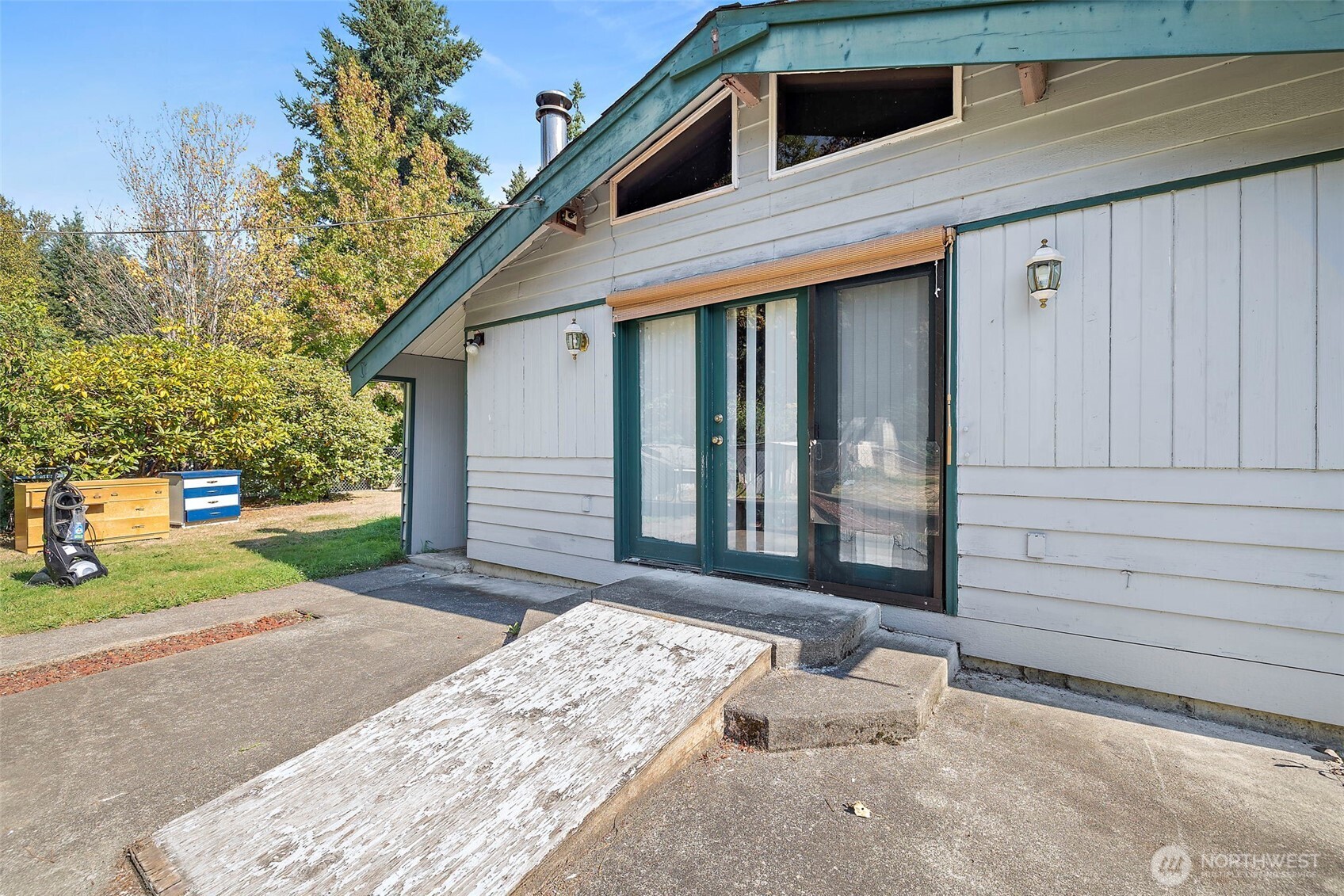 13435 Patriot Way Renton, WA 98059 - Photo 26 of 36 a side view of a house with a yard