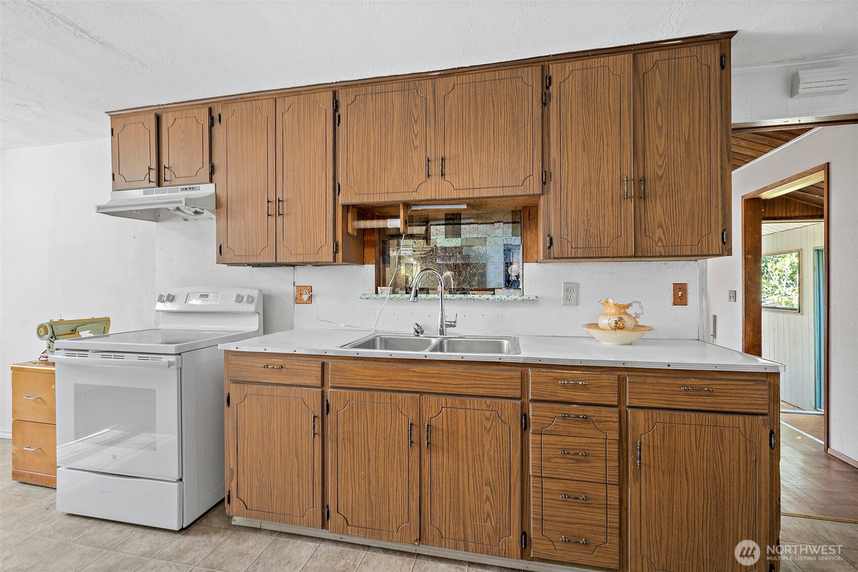 13435 Patriot Way Renton, WA 98059 - Photo 8 of 36 a kitchen with cabinets appliances a sink and a counter top space