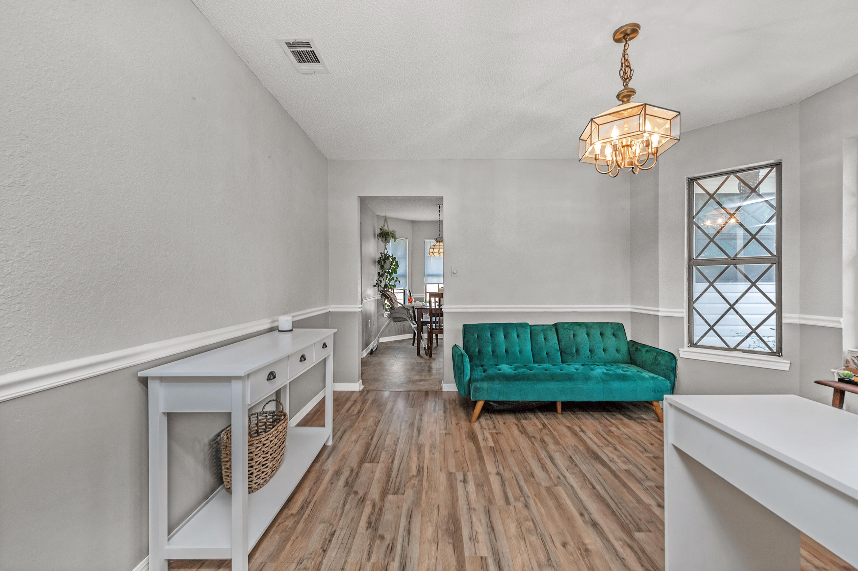 2788 Keats Drive Crestview, FL 32539 - Photo 11 of 32 a living room with furniture and a wooden floor