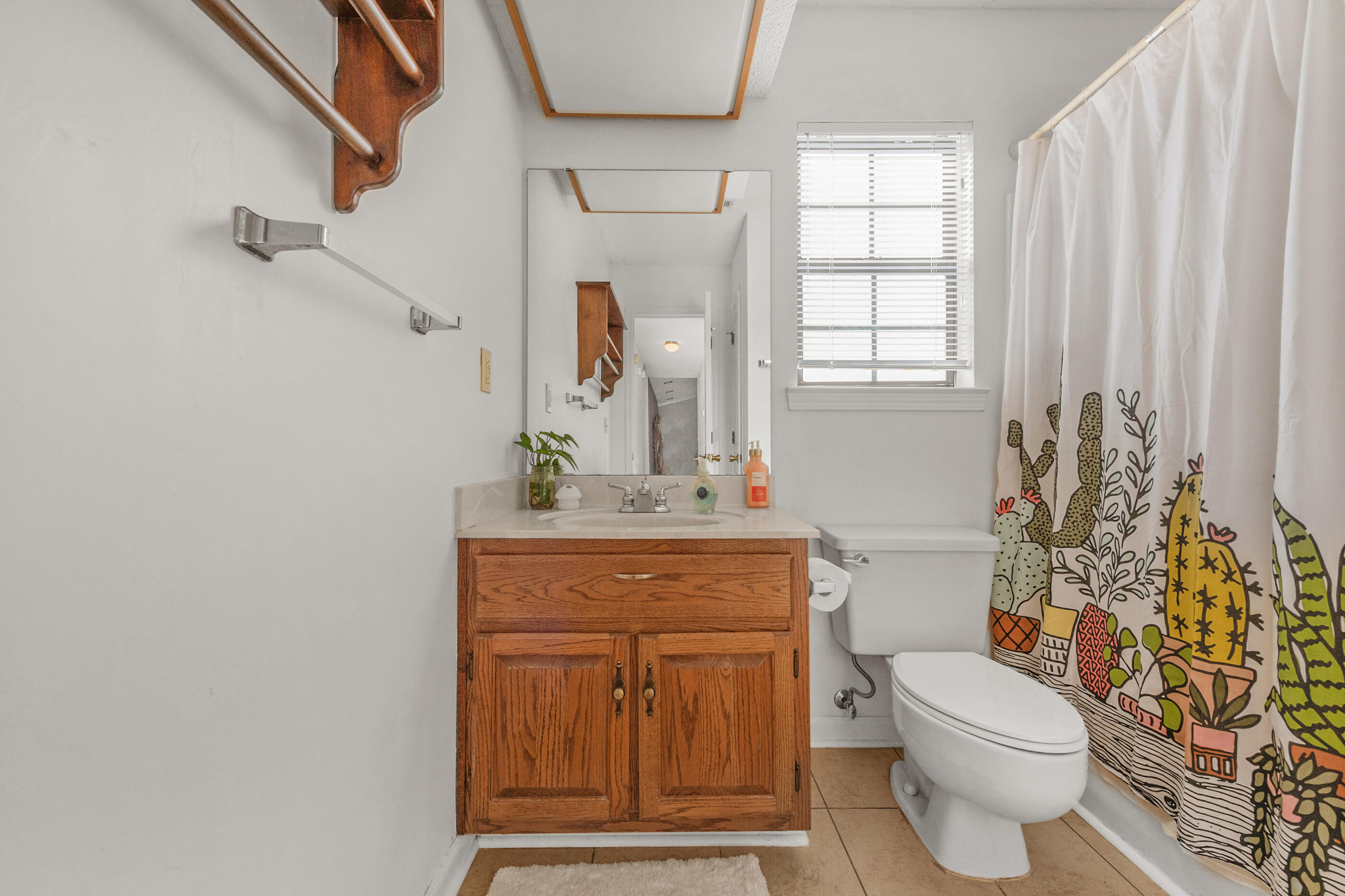 2788 Keats Drive Crestview, FL 32539 - Photo 20 of 32 a bathroom with a granite countertop toilet sink and mirror