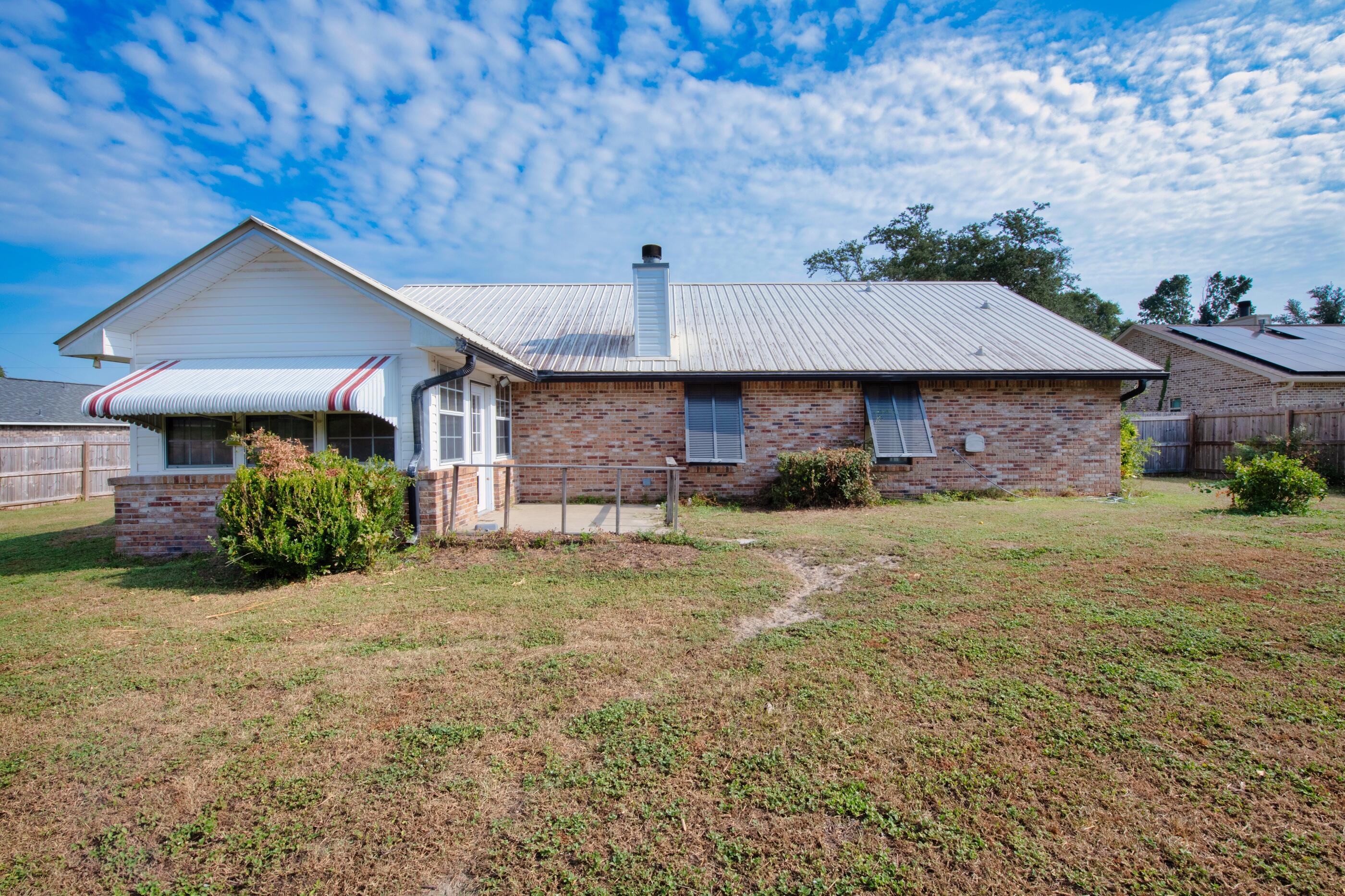 2788 Keats Drive Crestview, FL 32539 - Photo 32 of 32 a front view of a house with a yard and garage