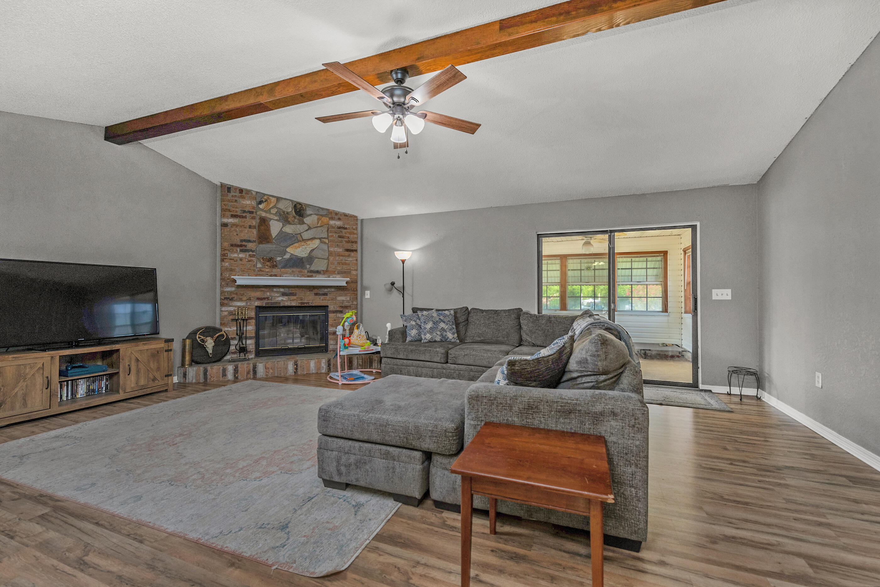2788 Keats Drive Crestview, FL 32539 - Photo 5 of 32 a living room with fireplace furniture and a flat screen tv