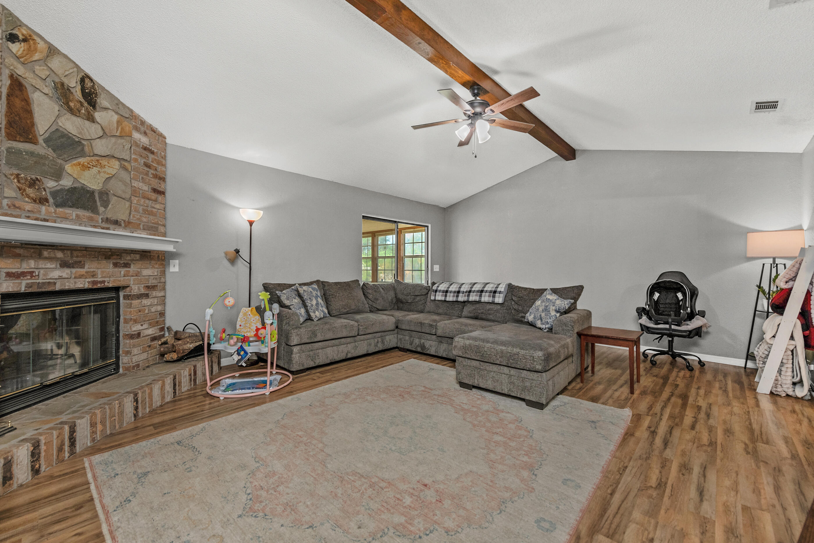 2788 Keats Drive Crestview, FL 32539 - Photo 6 of 32 a living room with furniture and a fireplace