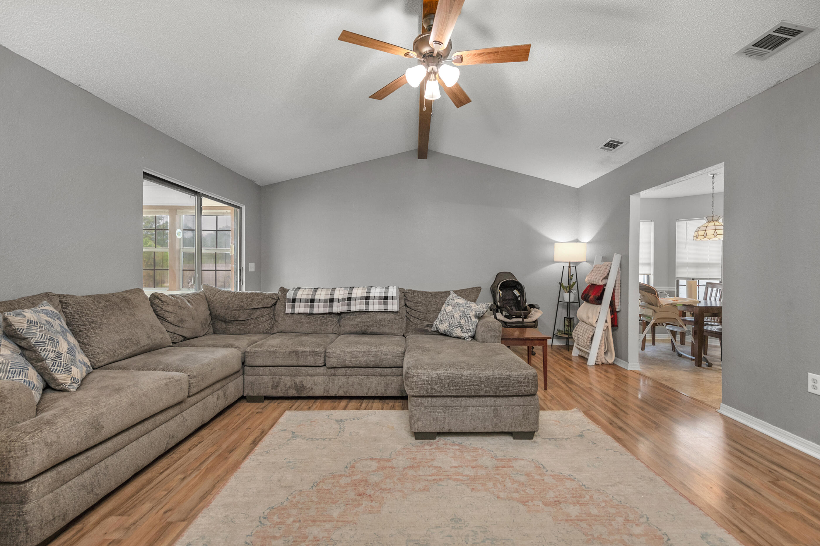 2788 Keats Drive Crestview, FL 32539 - Photo 7 of 32 a living room with furniture and a large window