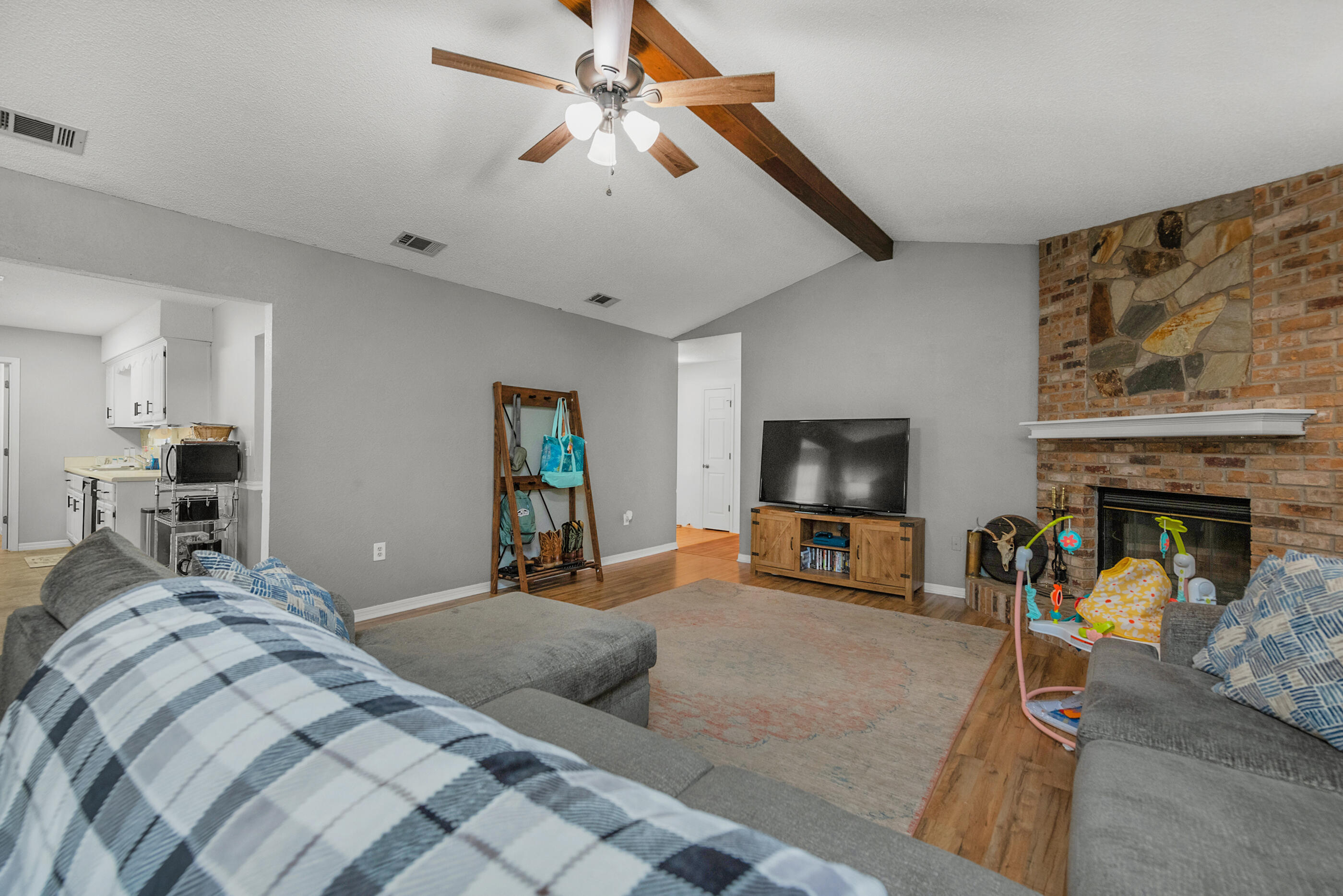 2788 Keats Drive Crestview, FL 32539 - Photo 9 of 32 a bedroom with furniture and a flat screen tv