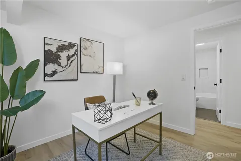 a view of a workspace with furniture