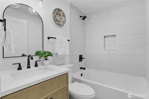 a bathroom with a sink a toilet and a bathtub