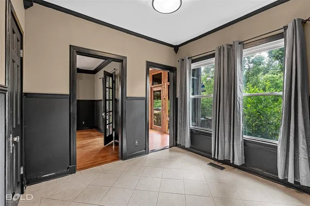a view of a hallway with wooden shelves