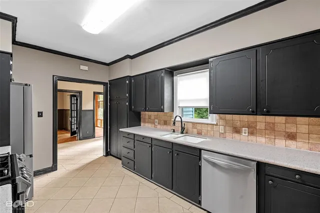 a kitchen with a sink and cabinets