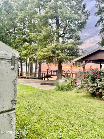 a view of swimming pool with outdoor seating and plants