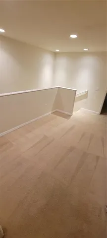 a bathroom with a granite countertop sink and toilet
