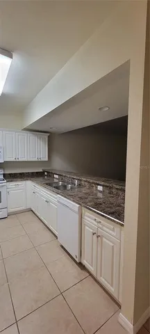 a view of a kitchen with electric appliances