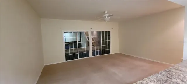 a view of empty room with windows