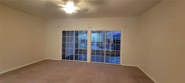 a view of empty room with windows