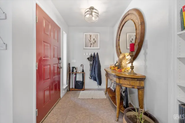 a living room with furniture and a kitchen view