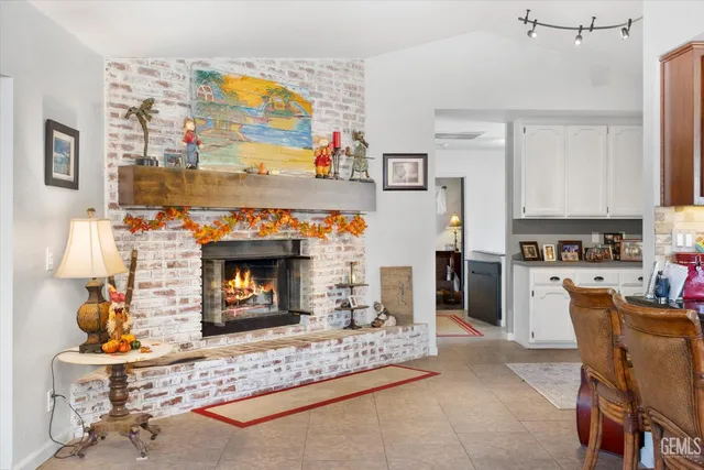 a living room with furniture a large window and a flat screen tv