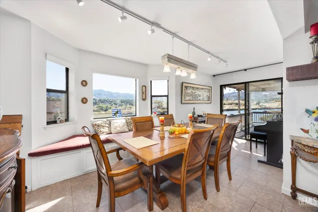 a view of a dining room with furniture window and outside view