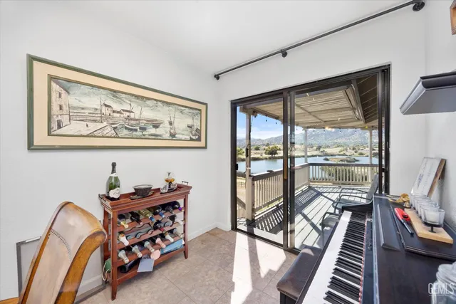 a kitchen with stainless steel appliances granite countertop a sink refrigerator and cabinets