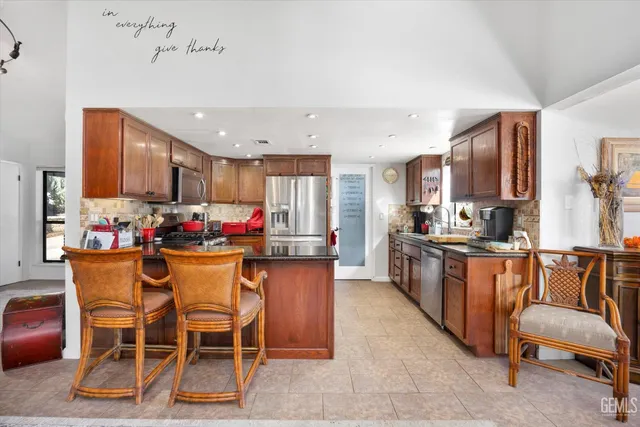 a en suite bathroom with a sink a mirror and a bathtub