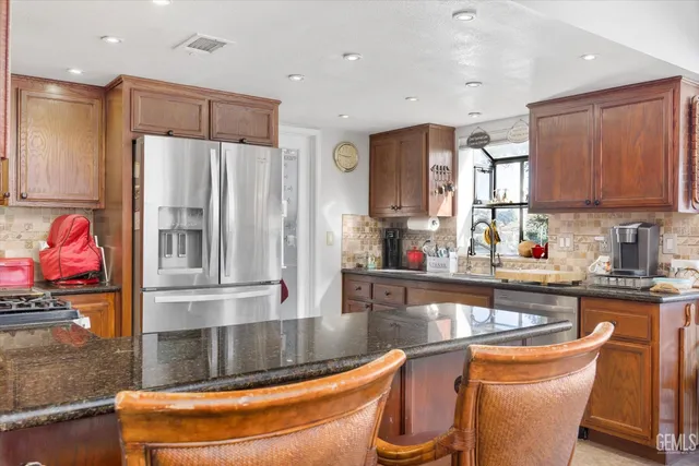 a spacious bathroom with a sink double vanity and a mirror