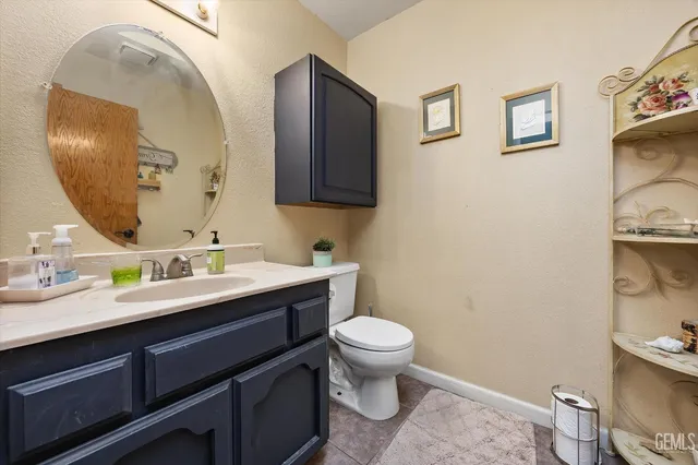 a view of a workspace with furniture and a flat screen tv