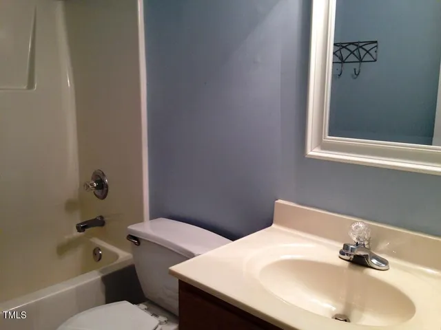 a bathroom with a sink and a toilet