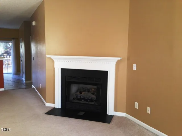 a living room with a fireplace
