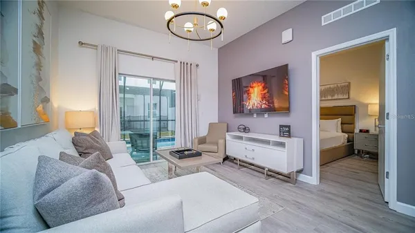 a living room with furniture and a flat screen tv