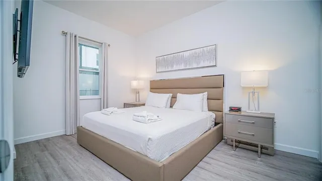 a large white bed in a white room