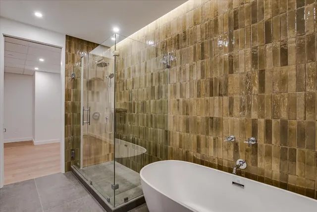 a bathroom with a shower and a sink