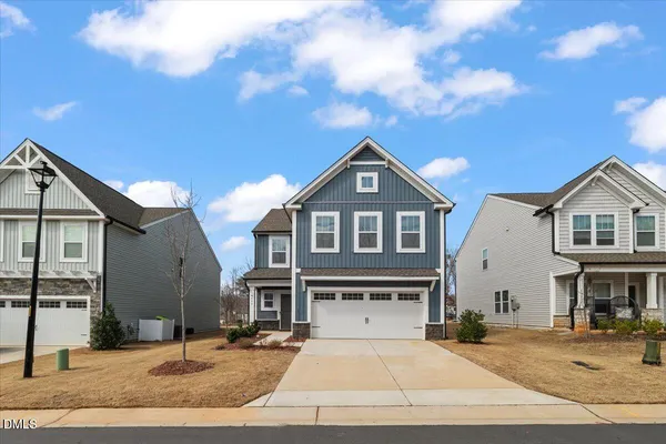 a front view of a house with yard