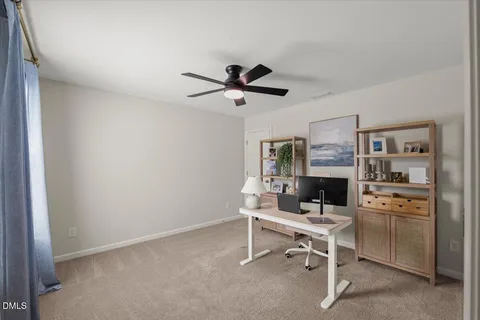 a work room with furniture and a chandelier