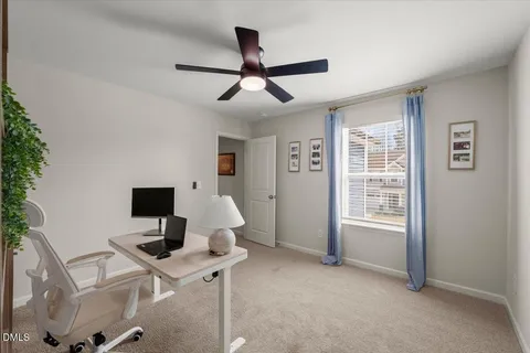 a work room with furniture and windows