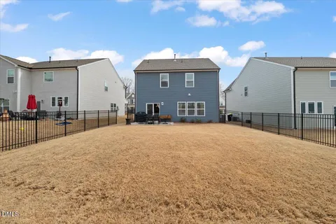 a view of a house with a snow on the road