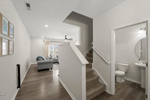 a view of entryway and hall with wooden floor
