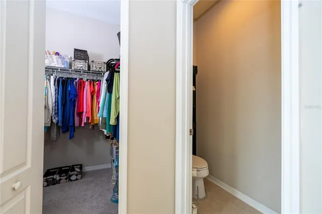 an aerial view of a swimming pool patio and lake view