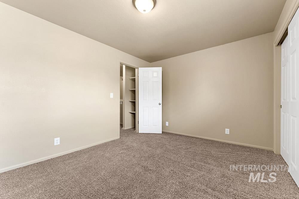 4806 Richardson Street Boise, ID 83705 - Photo 11 of 19 Unfurnished bedroom featuring carpet and a closet