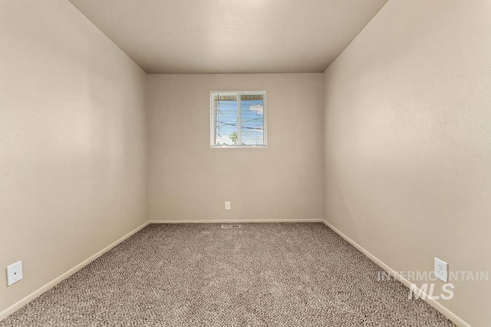 4806 Richardson Street Boise, ID 83705 - Photo 12 of 19 Carpeted empty room featuring baseboards