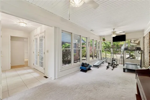 a view of living room with furniture and floor to ceiling window