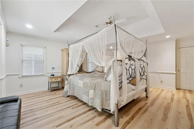 a white bed sitting in a room next to a white bed